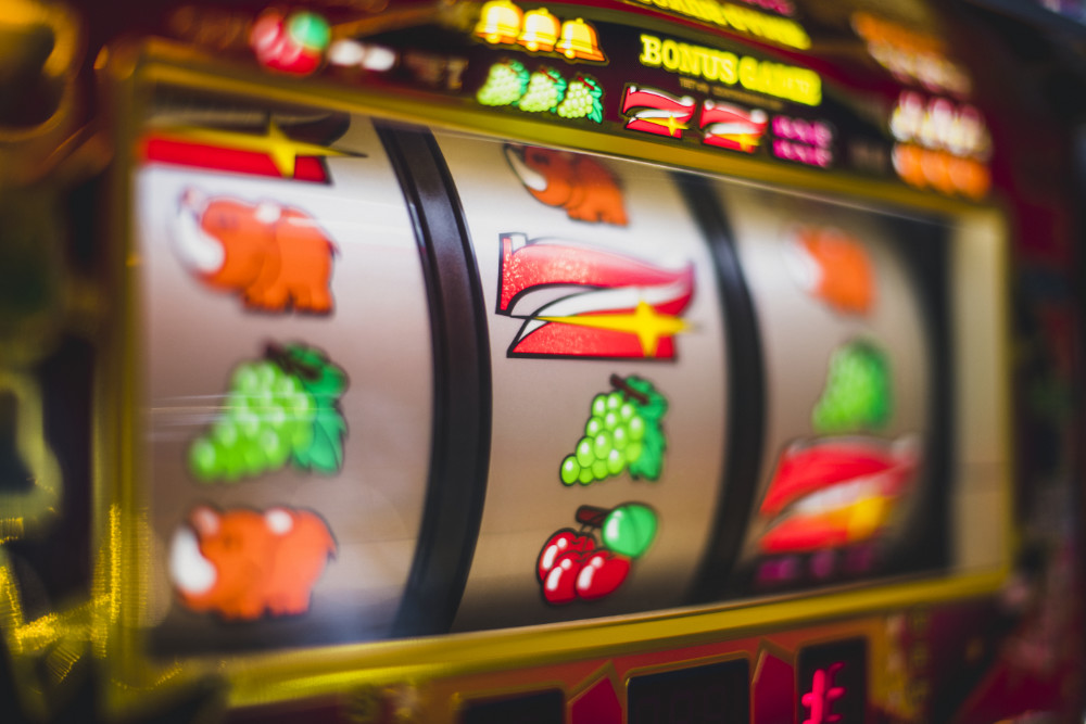 Closeup shot of a physical 3-reel slot machine at a casino